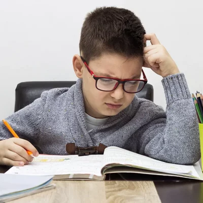 young-boy-frustrated-homework-writing-home-boy-studying-table-kid-drawing-with-pencil